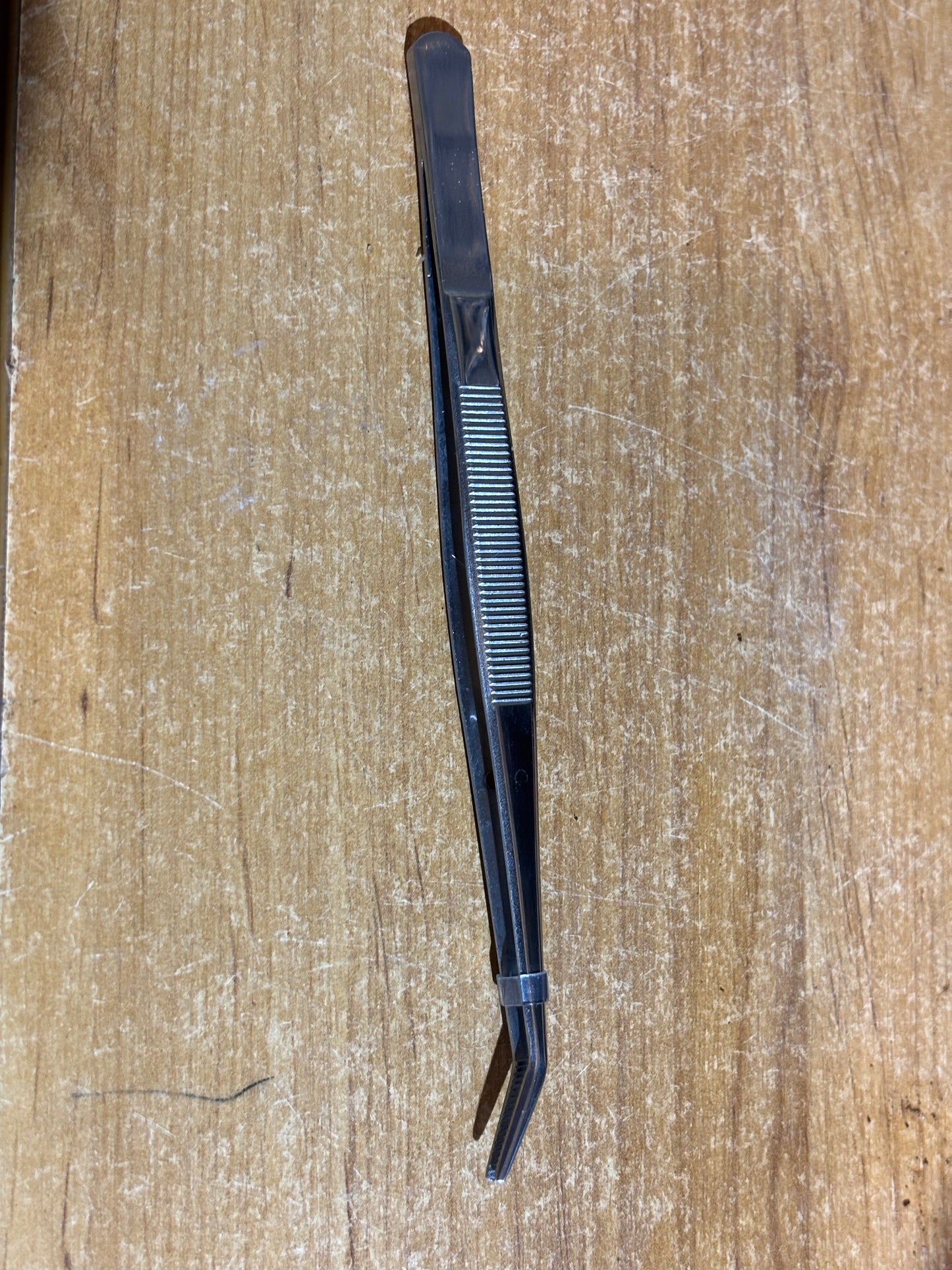 15cm bent end tweezers.