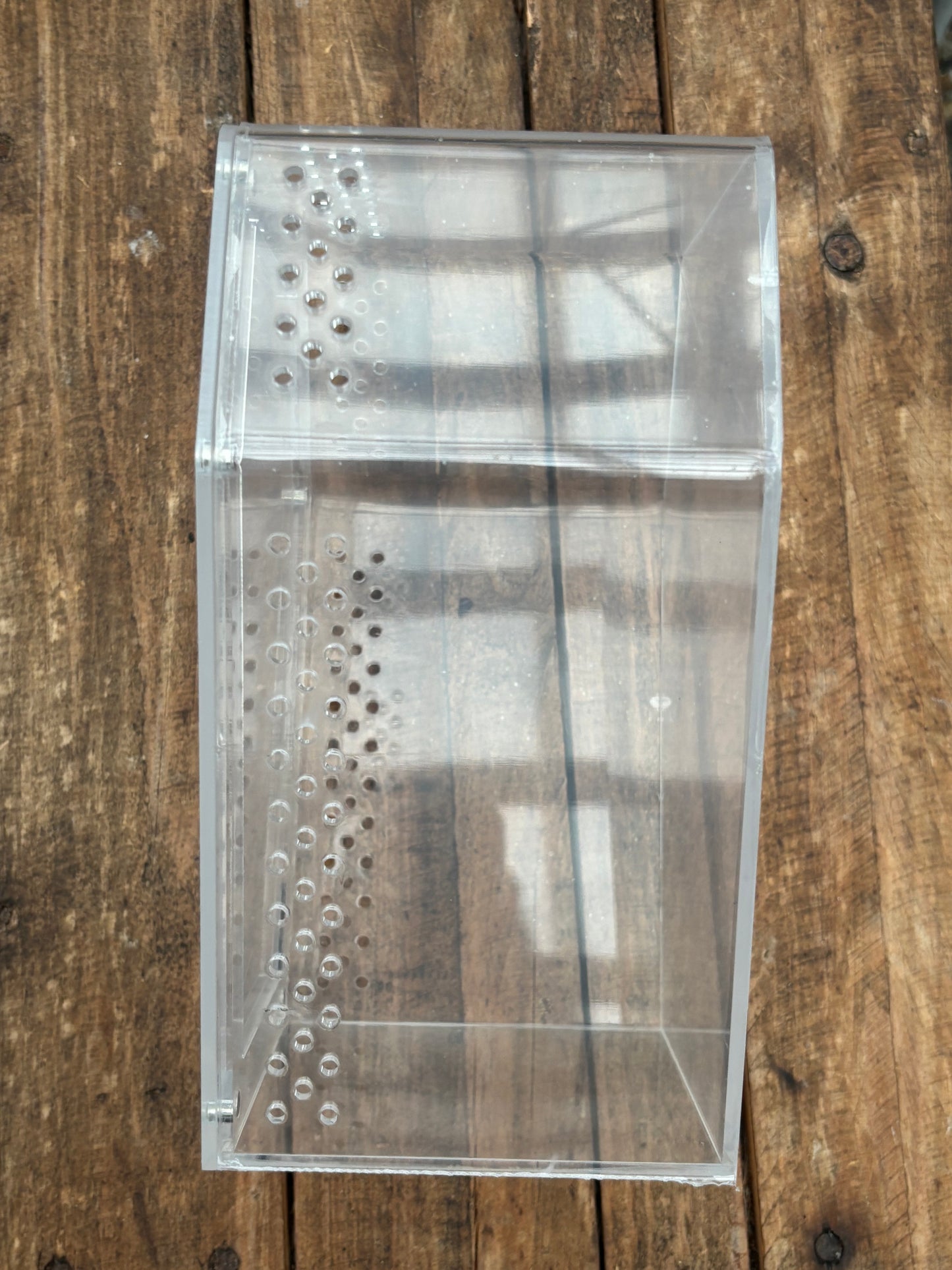 Coffin shaped enclosure 20cm longer x 14.5cm width at the widest points 10cm deep with strong magnetic lid.