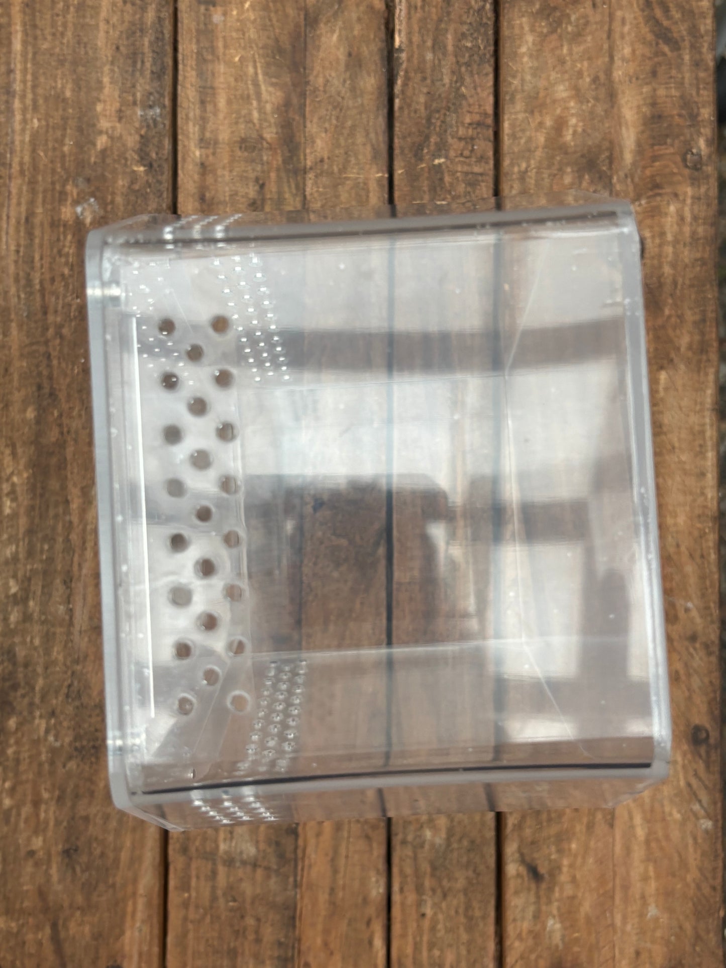 Coffin shaped enclosure 20cm longer x 14.5cm width at the widest points 10cm deep with strong magnetic lid.